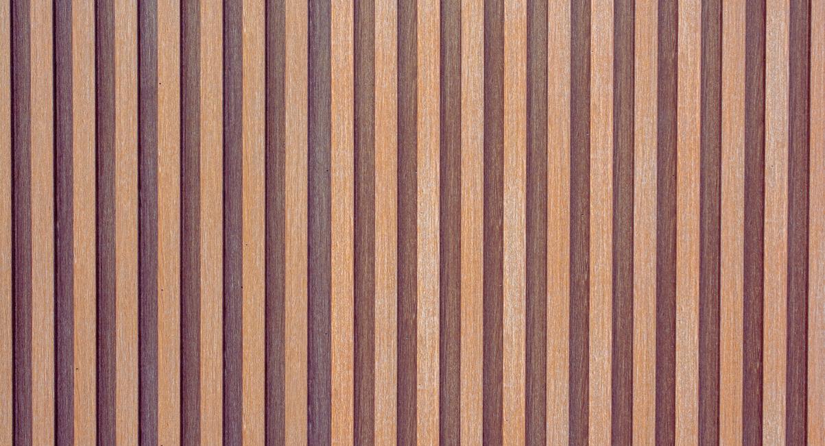 Facade recouverte de lames de bardage composite rainure aux tons bois varies